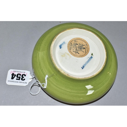 354 - A MOORCOFT POTTERY COLUMBINE INVERTED RIM DISH, Columbine pattern on a pale green ground, impressed ... 