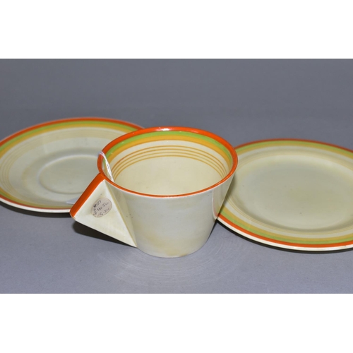 375 - A CLARICE CLIFF FOR NEWPORT POTTERY BIZARRE TRIO, teacup, saucer and tea plate with orange, green an... 