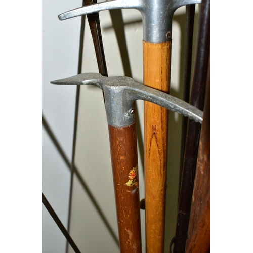 379 - A STICK STAND CONTAINING FENCING FOILS, VINTAGE GOLF CLUBS AND ICE PICKS, the brass stick stand heig... 