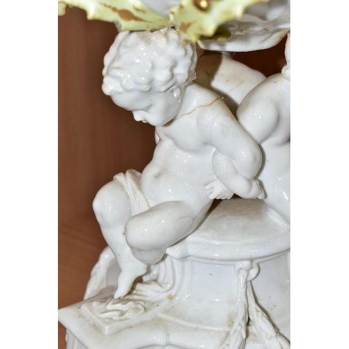 389 - SEVEN CERAMIC PIECES WITH MOULDED CHERUB DECORATION, comprising a centrepiece encrusted with flowers... 