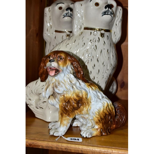 394 - A FISCHER AND MIEG FIGURE OF A SEATED SPANIEL AND A LARGE PAIR OF SADLER STAFFORDSHIRE SPANIELS, the... 