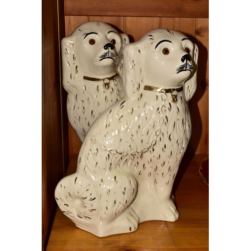 394 - A FISCHER AND MIEG FIGURE OF A SEATED SPANIEL AND A LARGE PAIR OF SADLER STAFFORDSHIRE SPANIELS, the... 