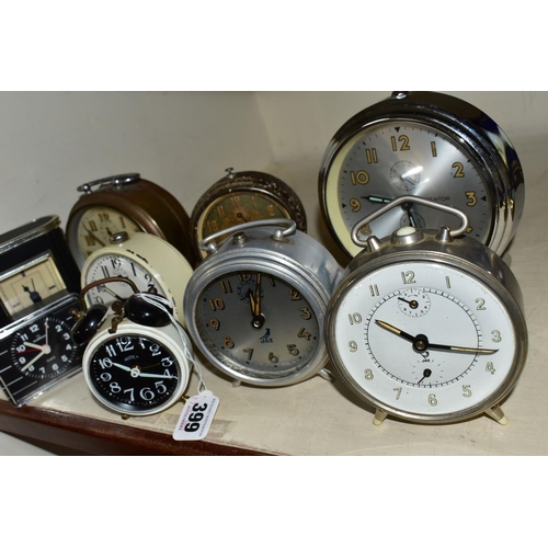 399 - A COLLECTION OF NINE VINTAGE BEDSIDE ALARM CLOCKS, comprising three Jaz French alarm clocks, an Art ... 