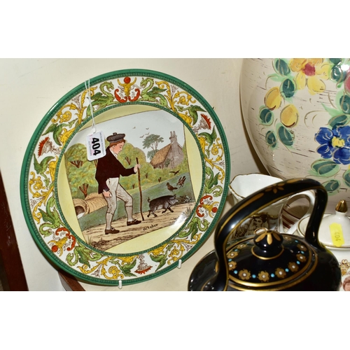 404 - A GROUP OF CERAMICS, comprising a Majolica 'Shrimper' wall plate (historic chips and missing paint),... 