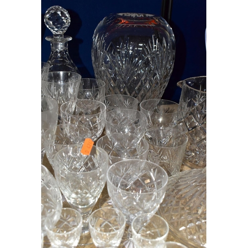 414 - A QUANTITY OF CUT CRYSTAL AND GLASSWARES, comprising a Waterford Lismore pattern ship's decanter, a ... 