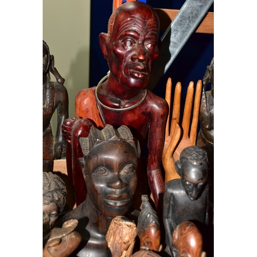 427 - A BOX OF WOODEN TOURIST TRIBAL ITEMS, to include mainly busts and figures of men and women, tallest ... 