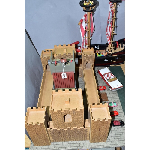 436 - AN EARLY LEARNING CENTRE CASTLE AND PIRATE SHIP, the castle on baseboard measuring 62cm x 61cm, havi... 