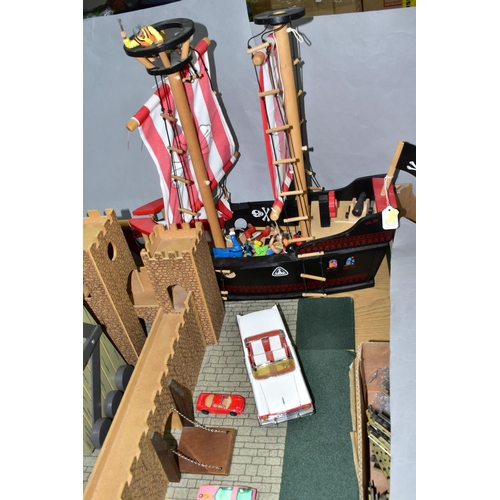 436 - AN EARLY LEARNING CENTRE CASTLE AND PIRATE SHIP, the castle on baseboard measuring 62cm x 61cm, havi... 