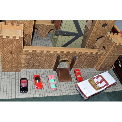 436 - AN EARLY LEARNING CENTRE CASTLE AND PIRATE SHIP, the castle on baseboard measuring 62cm x 61cm, havi... 