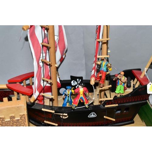 436 - AN EARLY LEARNING CENTRE CASTLE AND PIRATE SHIP, the castle on baseboard measuring 62cm x 61cm, havi... 