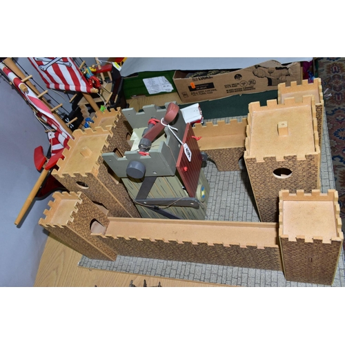 436 - AN EARLY LEARNING CENTRE CASTLE AND PIRATE SHIP, the castle on baseboard measuring 62cm x 61cm, havi... 