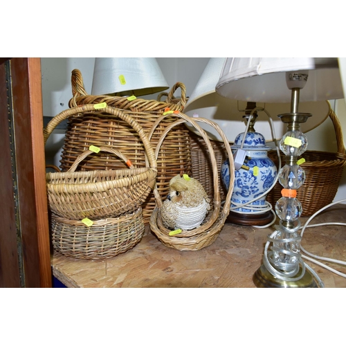 448 - EIGHT ASSORTED TABLE LAMPS AND A QUANTITY OF WICKER BASKETS, the lamps mostly ceramic based, all wit... 