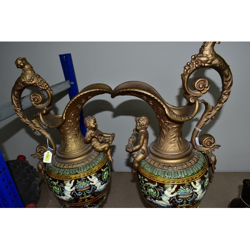 456 - A PAIR OF LATE VICTORIAN GILT SPELTER AND MAJOLICA EWERS, the scrolling handle cast with a beast and... 