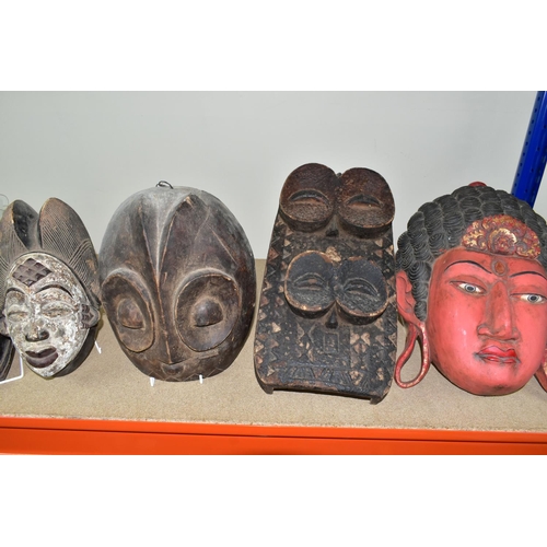 464 - FIVE TWENTIETH CENTURY WOODEN MASKS, four of African styles, the fifth in an Asian style (possibly B... 