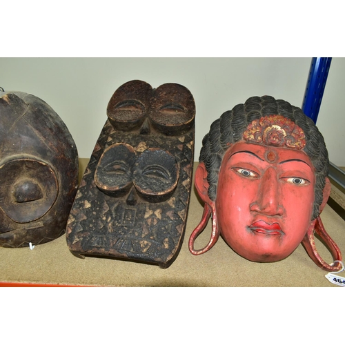 464 - FIVE TWENTIETH CENTURY WOODEN MASKS, four of African styles, the fifth in an Asian style (possibly B... 