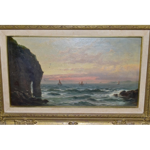 480 - GEORGE HENRY JENKINS (BRITISH 1843-1914) AN UNTITLED SUNSET MARITIME SEASCAPE, cliffs and rocks to t... 