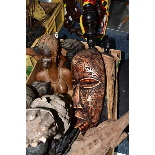 489 - A BOX AND LOOSE WOODEN TOURIST TRIBAL ART, to include masks, figures, busts, carved sticks, a spear ... 