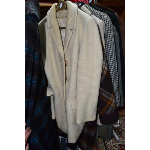 503 - A QUANTITY OF VINTAGE LADIES' CLOTHING, to include twelve coats, mainly thick woollen examples, a sh... 