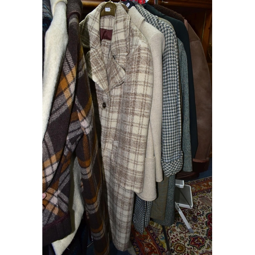 503 - A QUANTITY OF VINTAGE LADIES' CLOTHING, to include twelve coats, mainly thick woollen examples, a sh... 