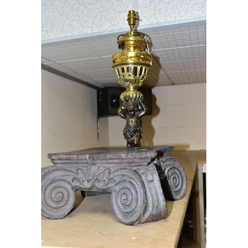 504 - A DECORATIVE ELECTRIC TABLE LAMP IN THE FORM OF AN OIL LAMP, comprising a cast brass base, reservoir... 