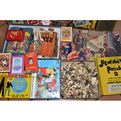 527 - A QUANTITY OF ASSORTED VINTAGE JIGSAWS, GAMES, CARD GAMES AND PUZZLES, to include a Walt Disney Snow... 