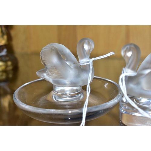 533 - TWO LALIQUE RING / PIN TRAYS AND A LALIQUE PAPERWEIGHT, the two clear glass ring trays with a froste... 