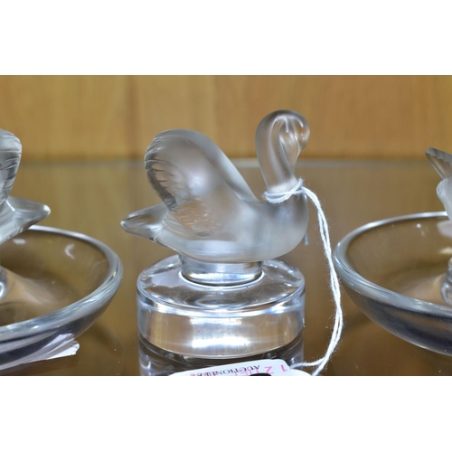 533 - TWO LALIQUE RING / PIN TRAYS AND A LALIQUE PAPERWEIGHT, the two clear glass ring trays with a froste... 