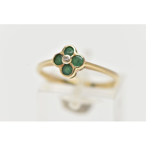 12 - A 9CT YELLOW GOLD DIAMOND AND EMERALD CLUSTER RING, set with a round brilliant cut diamond surrounde... 