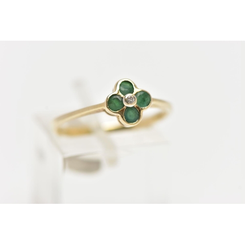 12 - A 9CT YELLOW GOLD DIAMOND AND EMERALD CLUSTER RING, set with a round brilliant cut diamond surrounde... 