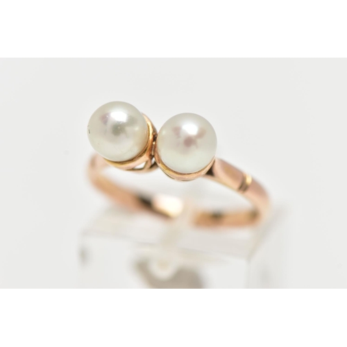 17 - A YELLOW METAL CULTURED PEARL RING, designed with two white cultured pearls, measuring approximately... 