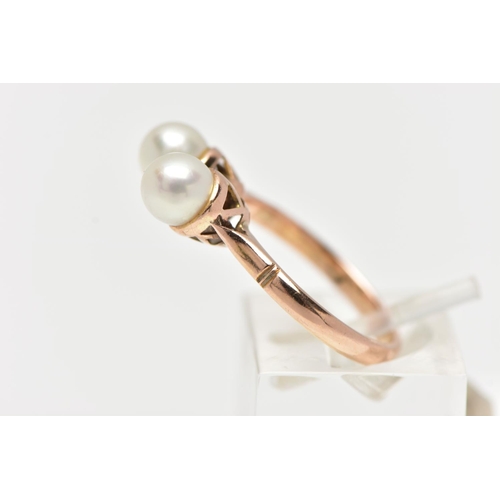 17 - A YELLOW METAL CULTURED PEARL RING, designed with two white cultured pearls, measuring approximately... 