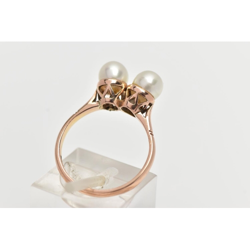 17 - A YELLOW METAL CULTURED PEARL RING, designed with two white cultured pearls, measuring approximately... 