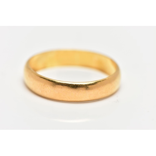 31 - A LARGE 22CT GOLD BAND RING, a courted band ring, approximate width 5.5mm, hallmarked 22ct Birmingha... 