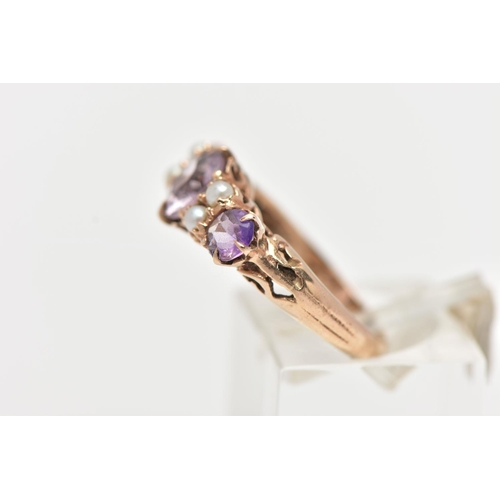 4 - A YELLOW METAL GEM SET RING, designed with three circular cut amethysts, each interspaced with four ... 