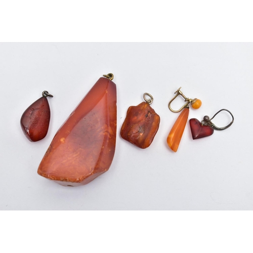 48 - A NATURAL AMBER PENDANT, a large polished natural amber pendant, approximate length 59mm, approximat... 