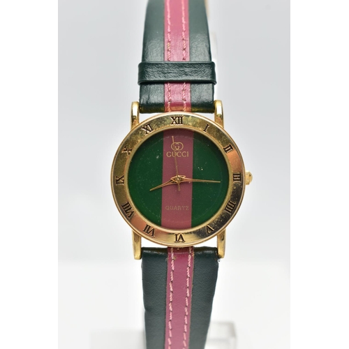 52 - A 'GUCCI' QUARTZ WRISTWATCH, featuring a round green and burgundy stripped dial signed 'Gucci quartz... 