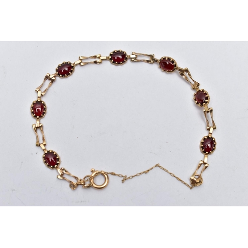 63 - A 9CT YELLOW GOLD GARNET BRACELET, set with seven garnet cabochons, each claw set to a collet mount,... 