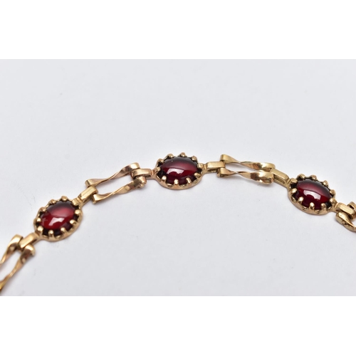 63 - A 9CT YELLOW GOLD GARNET BRACELET, set with seven garnet cabochons, each claw set to a collet mount,... 