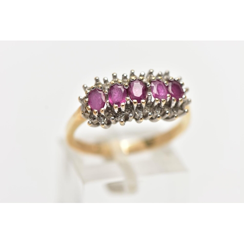 65 - A 9CT YELLOW GOLD RUBY AND DIAMOND CLUSTER RING, the cluster of an oval form, to the center is five ... 