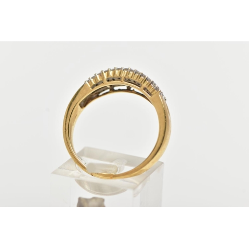 70 - AN 18CT YELLOW GOLD DIAMOND HALF ETERNITY RING, designed with a central row of baguette cut diamonds... 