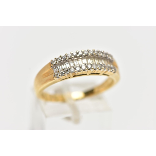 70 - AN 18CT YELLOW GOLD DIAMOND HALF ETERNITY RING, designed with a central row of baguette cut diamonds... 