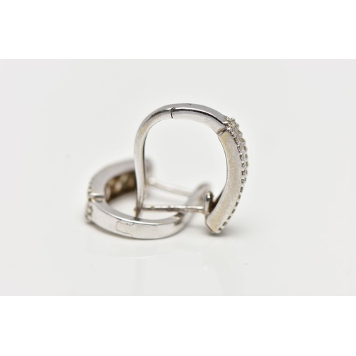 72 - A PAIR OF 9CT WHITE GOLD DIAMOND SET EARRINGS, each of a half hoop, to the center is a row of baguet... 