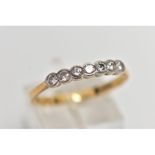 75 - AN 18CT GOLD SEVEN STONE DIAMOND RING, a row of collet set round brilliant cut diamonds, estimated t... 