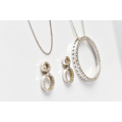 82 - A 9CT WHITE GOLD DIAMOND PENDANT NECKLACE AND MATCHING EARRINGS, the pendant of an openwork circular... 