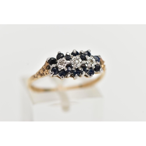 9 - A 9CT YELLOW GOLD DIAMOND AND SAPPHIRE DRESS RING, set with three diamond accents, surrounded by cir... 