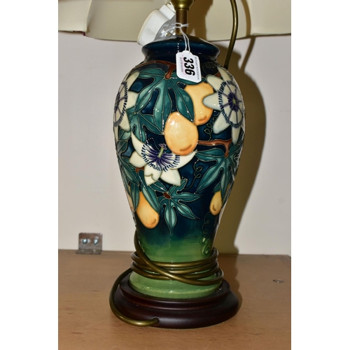 336 - A PAIR OF MOORCROFT POTTERY 'PASSION FLOWER' TABLE LAMPS, of baluster form, with tube lined passion ... 