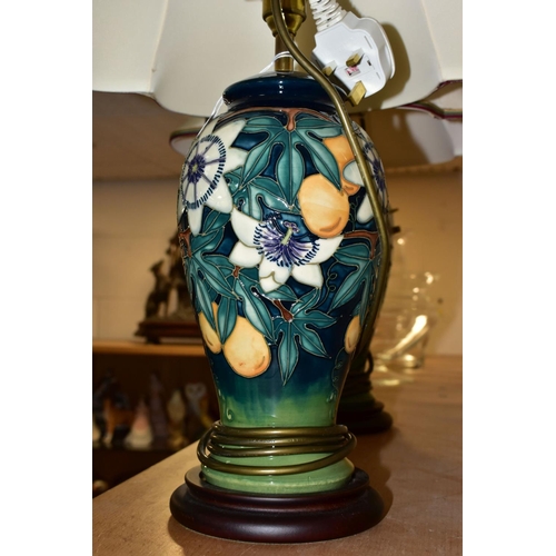 336 - A PAIR OF MOORCROFT POTTERY 'PASSION FLOWER' TABLE LAMPS, of baluster form, with tube lined passion ... 