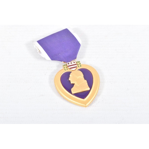 228 - A MIXED PARCEL OF MEDALS FROM VARIOUS COUNTRIES to include an unnamed Purple Heart, an Order Of Beni... 