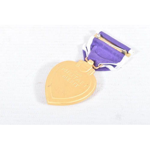 228 - A MIXED PARCEL OF MEDALS FROM VARIOUS COUNTRIES to include an unnamed Purple Heart, an Order Of Beni... 