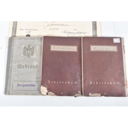 229 - A COLLECTION OF GERMAN MEDALS AND PASSBOOKS, from WW1 and WW2 including an Adolf Hitler medal, WW2 p... 